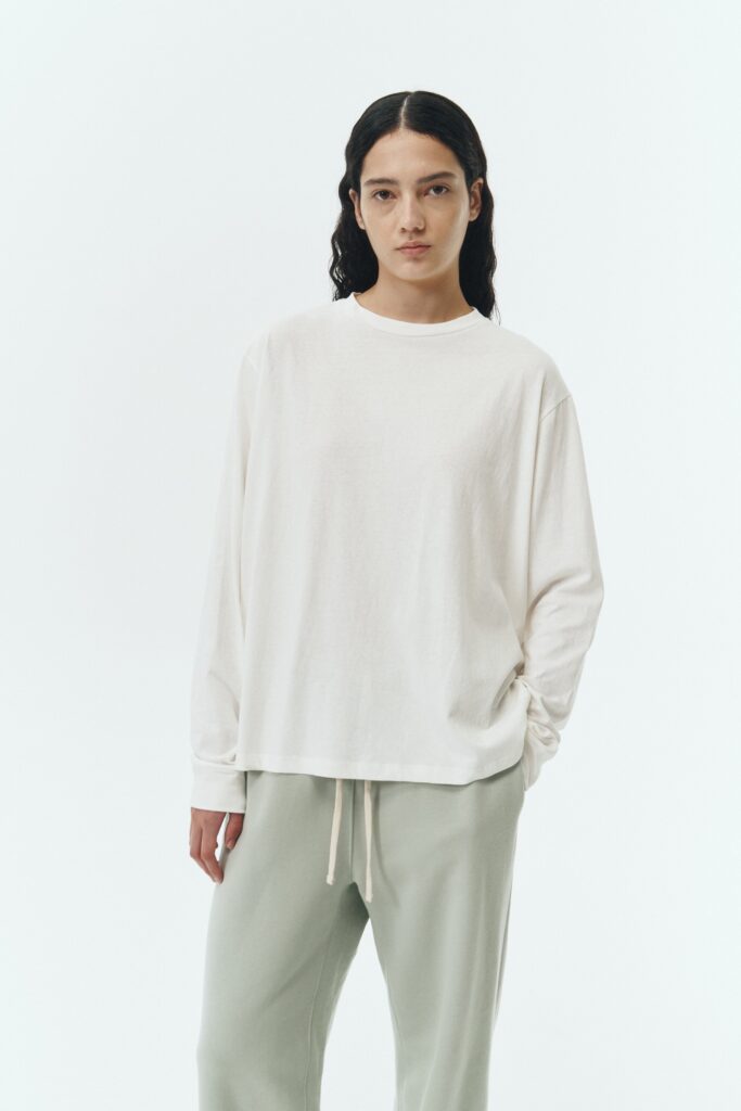 Lara Long-Sleeved T-Shirt in washed white, a lightweight cotton crew-neck tee with long sleeves and relaxed fit, ideal for everyday wear and seasonal layering