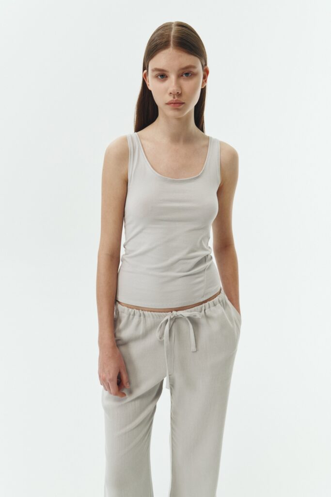 Zoe Tank Top in cloud gray, slim-fit stretch cotton tank with scooped neckline and diagonal seam detail for a sleek and minimal silhouette.