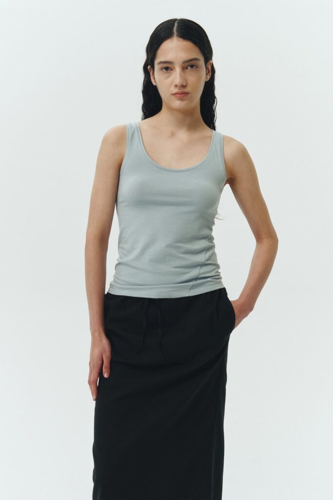 Zoe Tank Top in sky, slim-fit stretch cotton tank with scooped neckline and diagonal seam detail for a sleek and minimal silhouette.